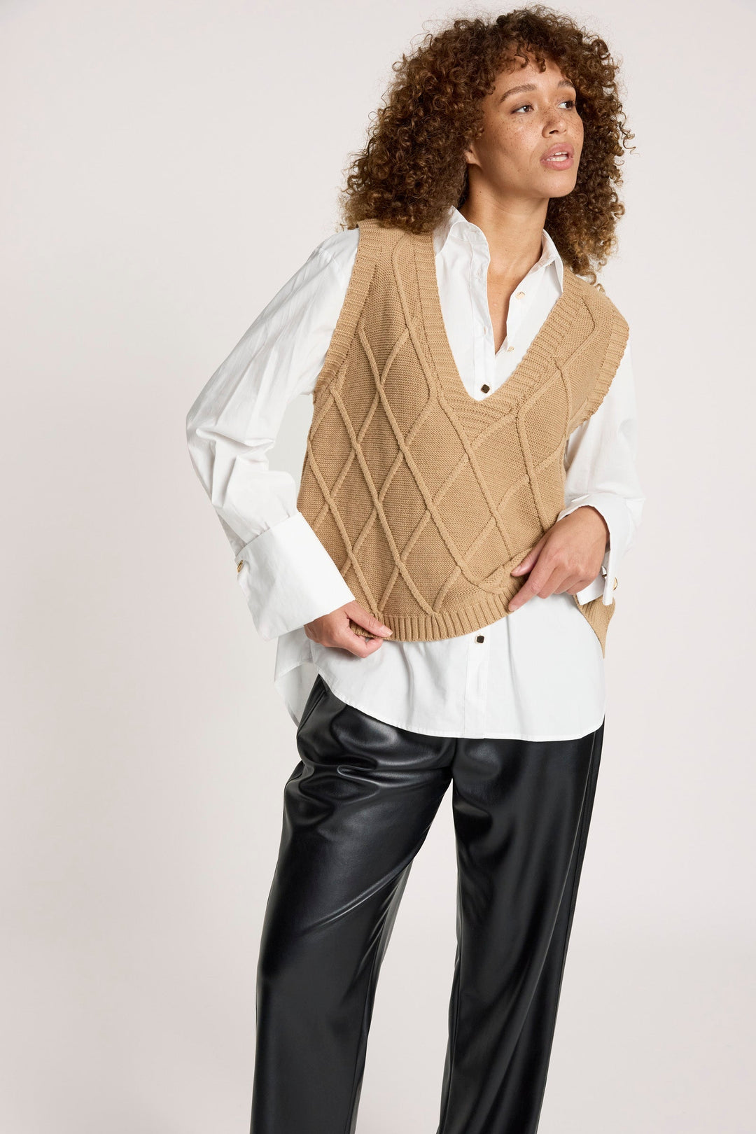Women's V-neck patterned knit vest in mocha color close-up fabric detail