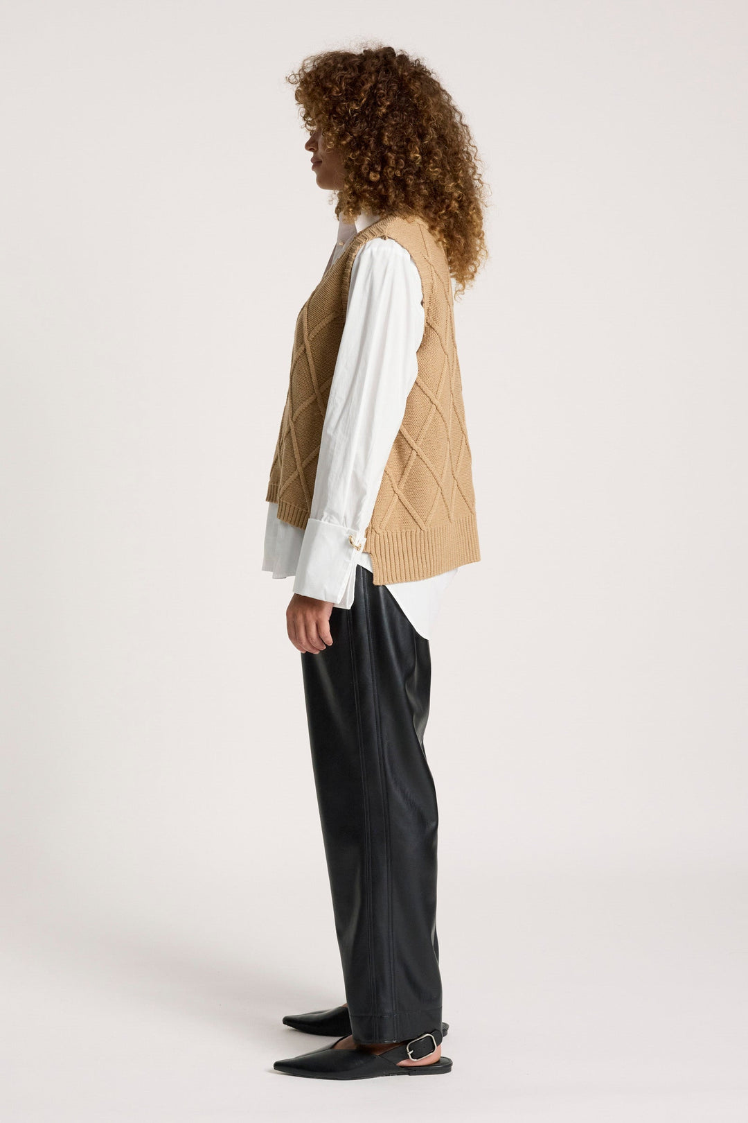Flat lay of mocha women's knit vest and layering top for fall outfit