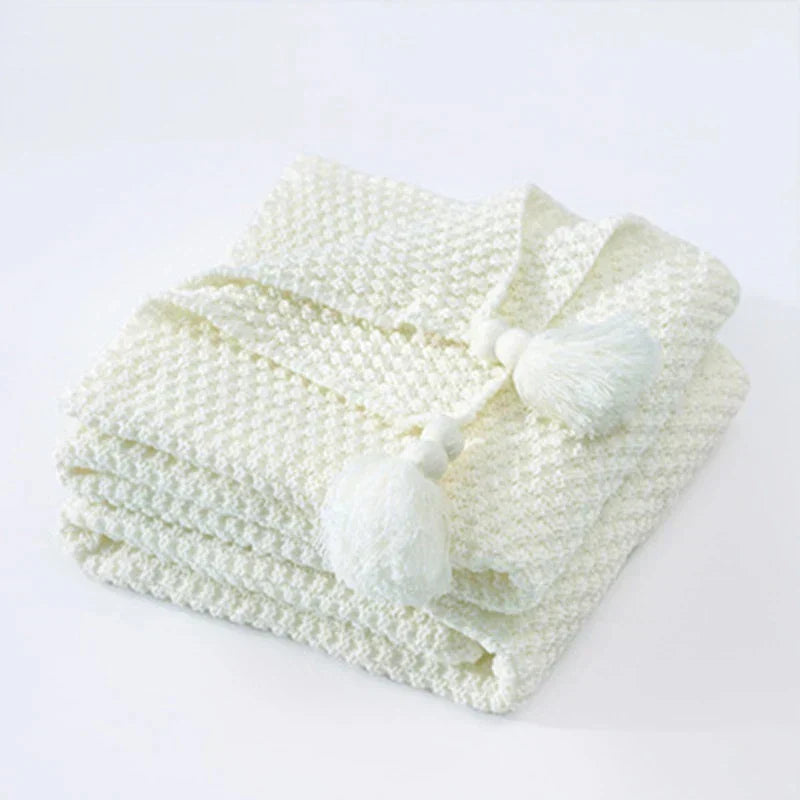 Close-up of cozy knitted throw blanket texture and pattern
