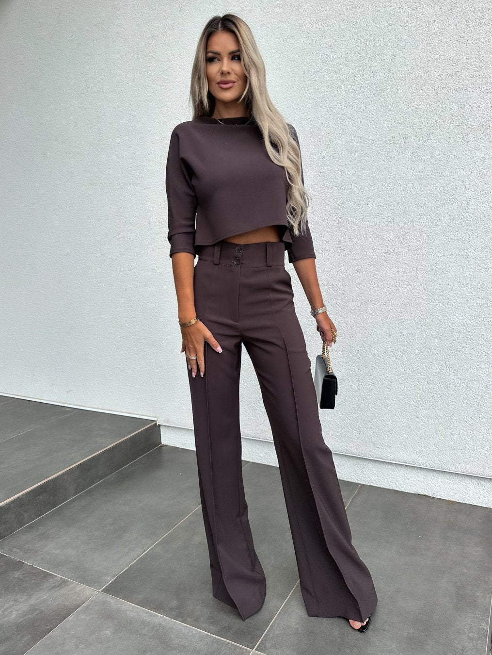 Model wearing the sophisticated women fashion two piece trouser set