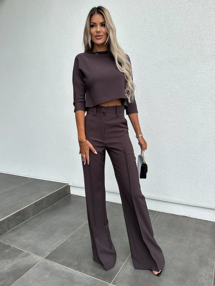 Model wearing the sophisticated women fashion two piece trouser set