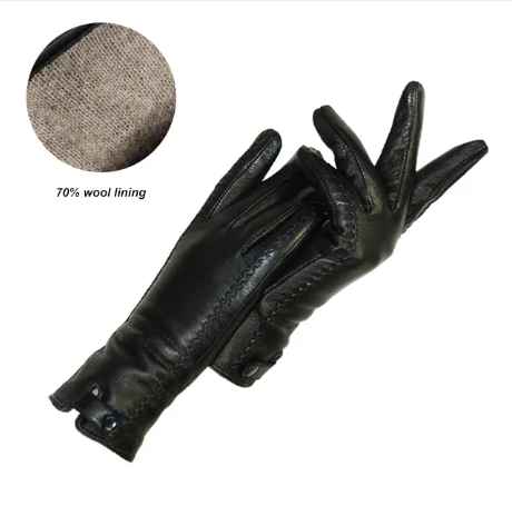Black vintage leather gloves showing wool lining detail inset
