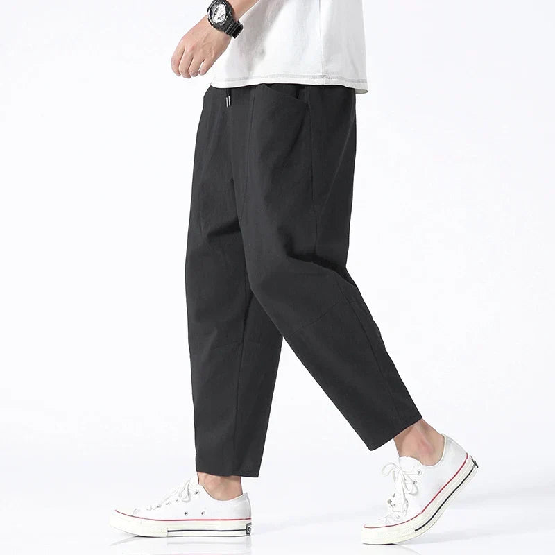 Man wearing black Kyoto cropped trousers from the side view
