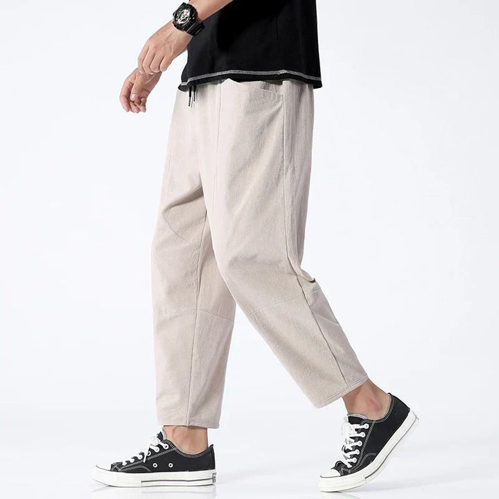 Man wearing khaki Kyoto cropped trousers from the side view