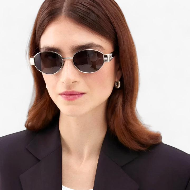 Luxury summer fashion glasses for women displayed on a neutral surface