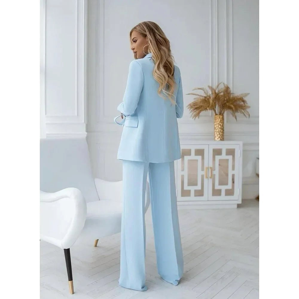Back view of woman standing in the elegant two-piece tailored suit