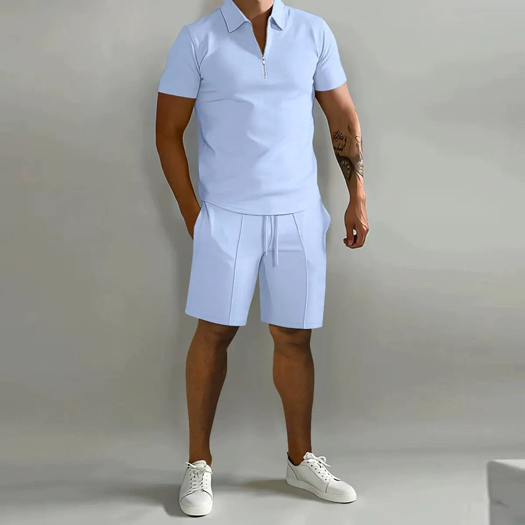 Flat lay of the complete mens zip-neck polo and shorts lounge set