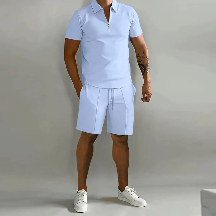 Flat lay of the complete mens zip-neck polo and shorts lounge set