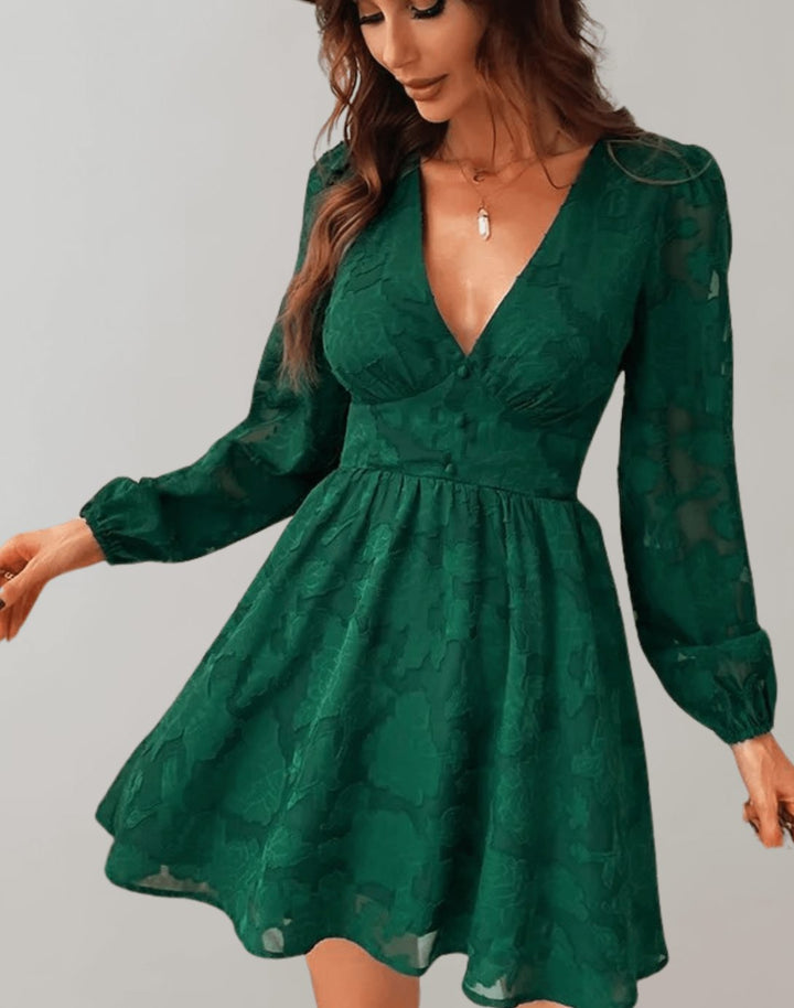 Model wearing a green floral jacquard long sleeve V-neck party dress