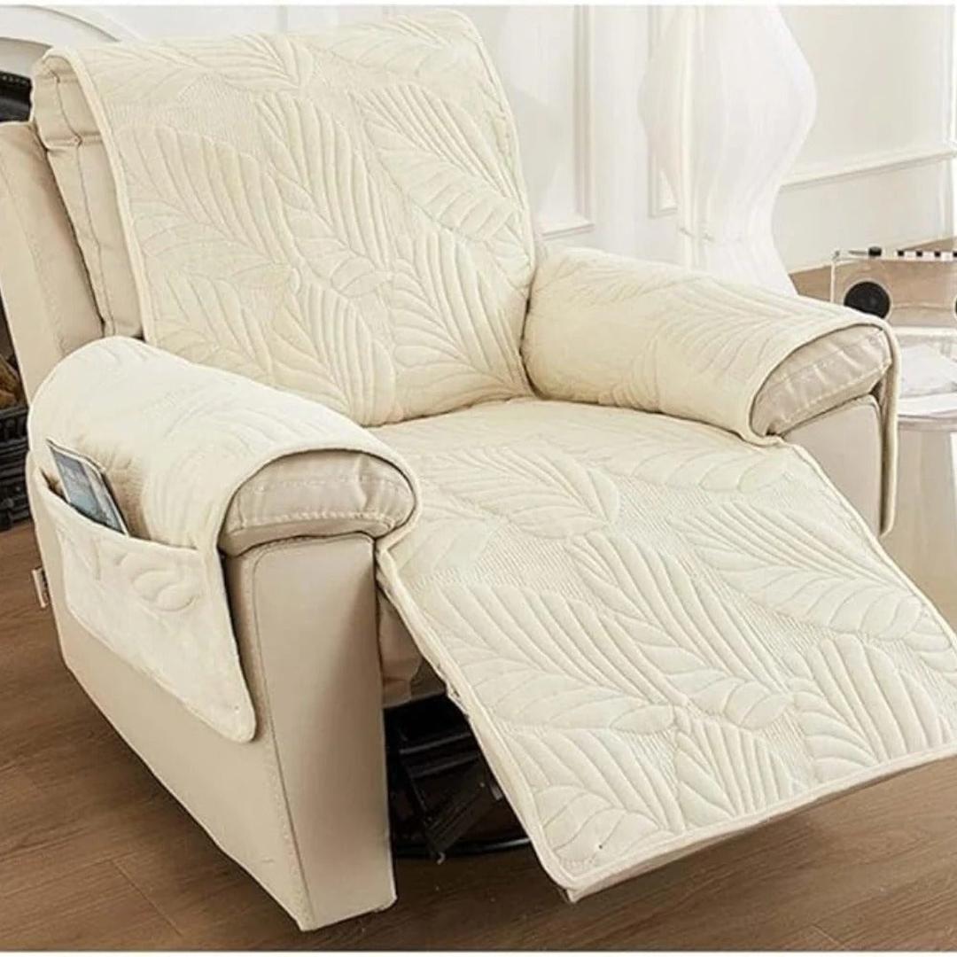 White leaf pattern quilted recliner slipcover displayed on a chair