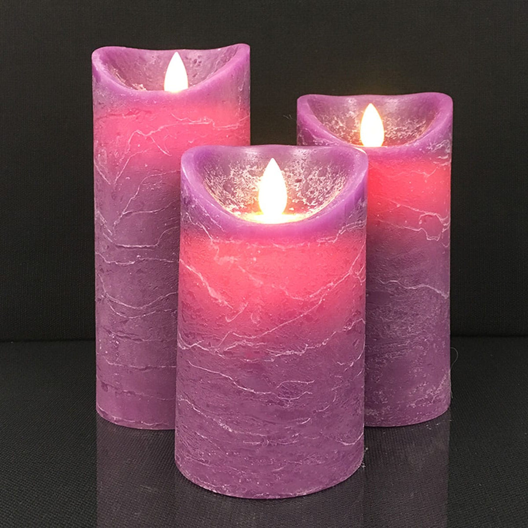 Safe battery-operated rustic red and gray candles arranged on a wooden table