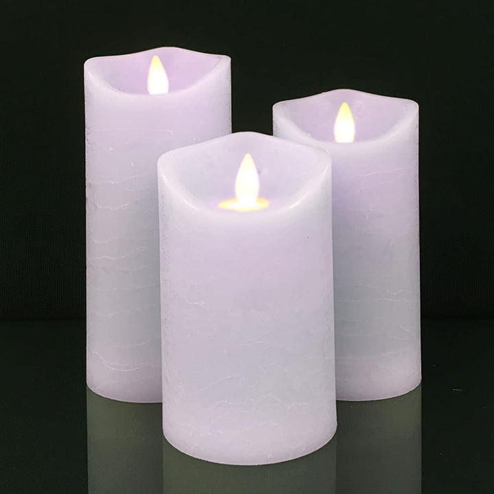 Decorative pillar candles with textured rustic finish providing ambient lighting