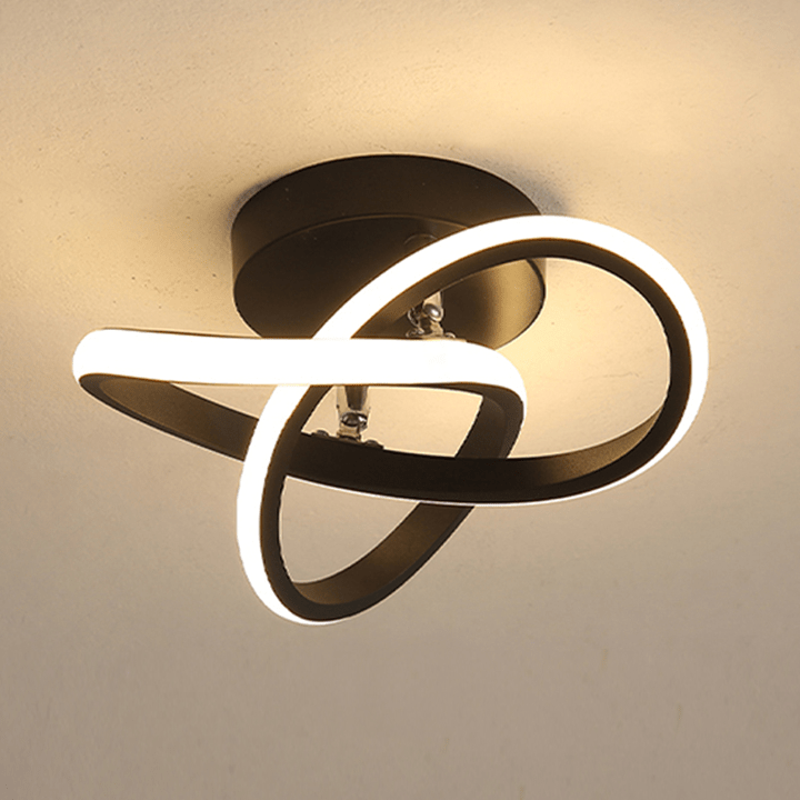 Close-up view of the Black Circle modern LED ceiling fixture glowing on a ceiling