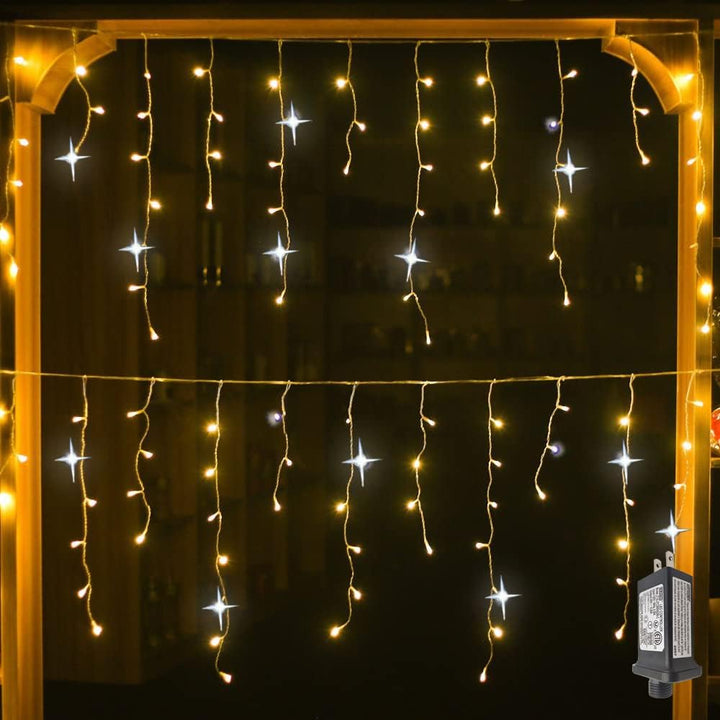Close-up view of warm glowing LED light curtain strings with sparkling twinkling bulbs