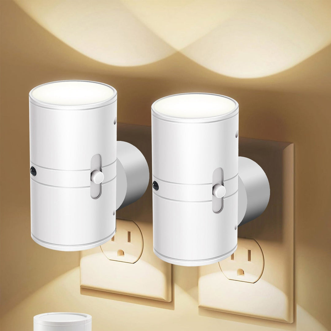 Energy efficient plug-in LED night light with automatic sensor glowing in dark room