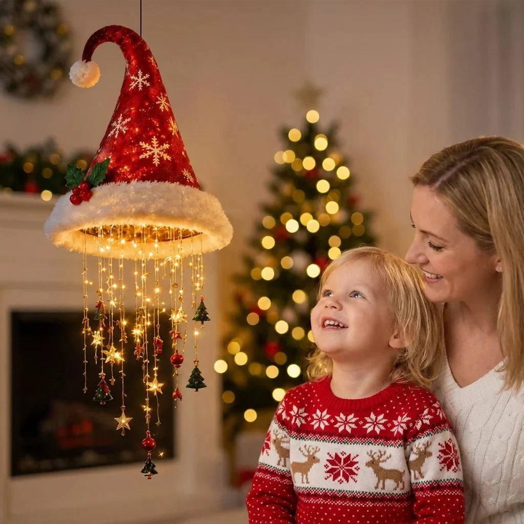 Smiling child looking up at a glowing LED Santa hat decorated with hanging string lights