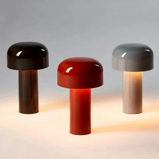 Portable touch lamp emitting warm white illumination at dusk