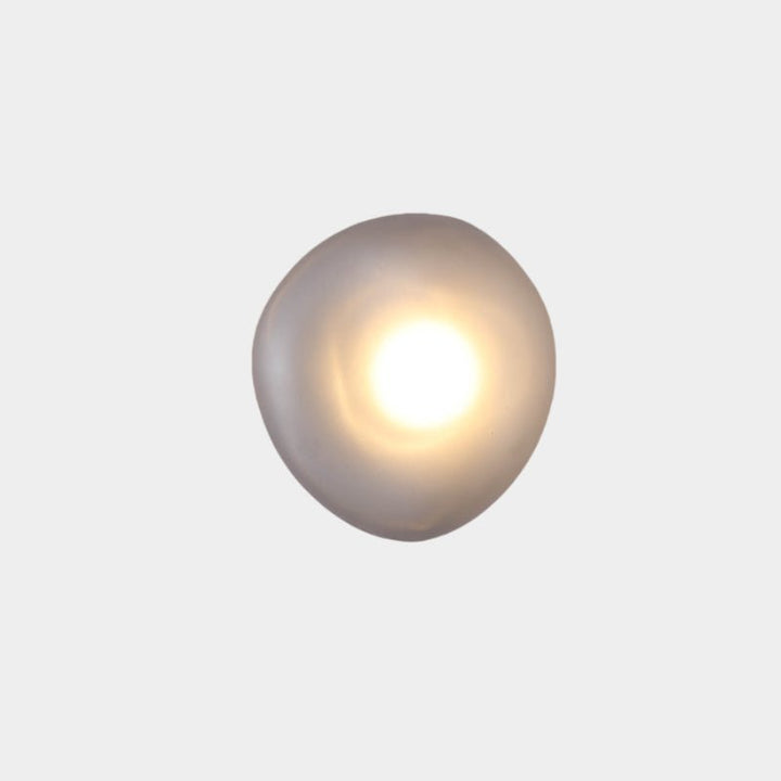 Detailed shot of wall lamp mounting and sleek metal finish