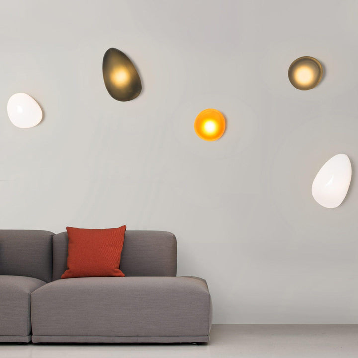 Decorative interior lighting featuring a unique oval glass shade