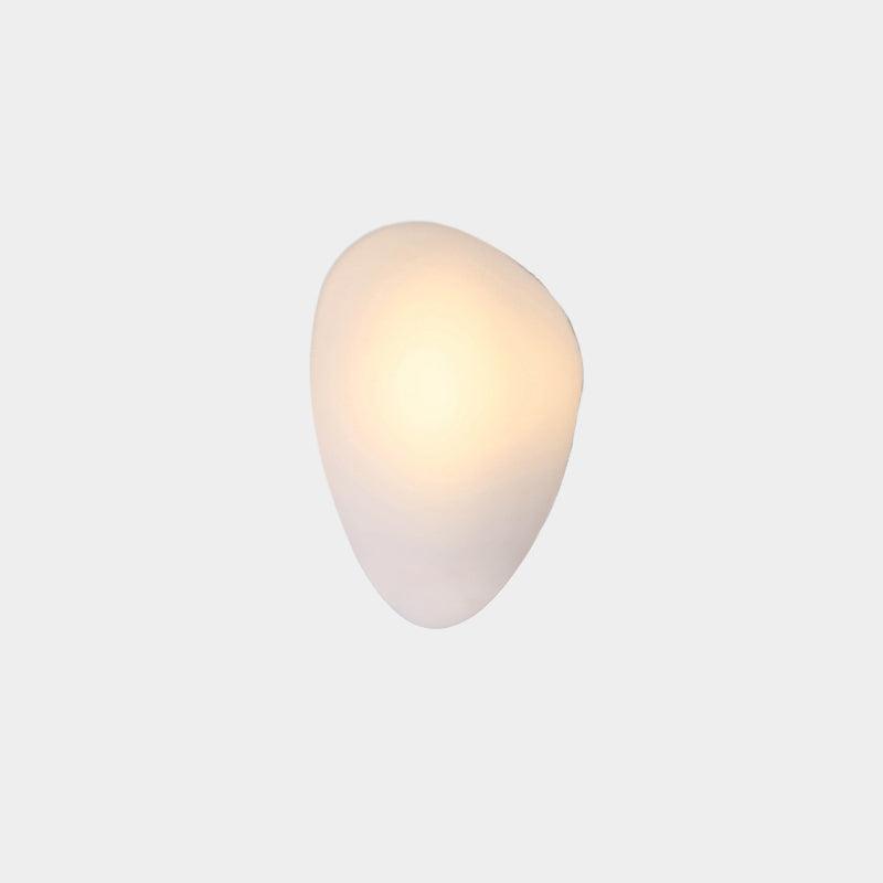 Adjustable lighting LED wall sconce illuminating a hallway