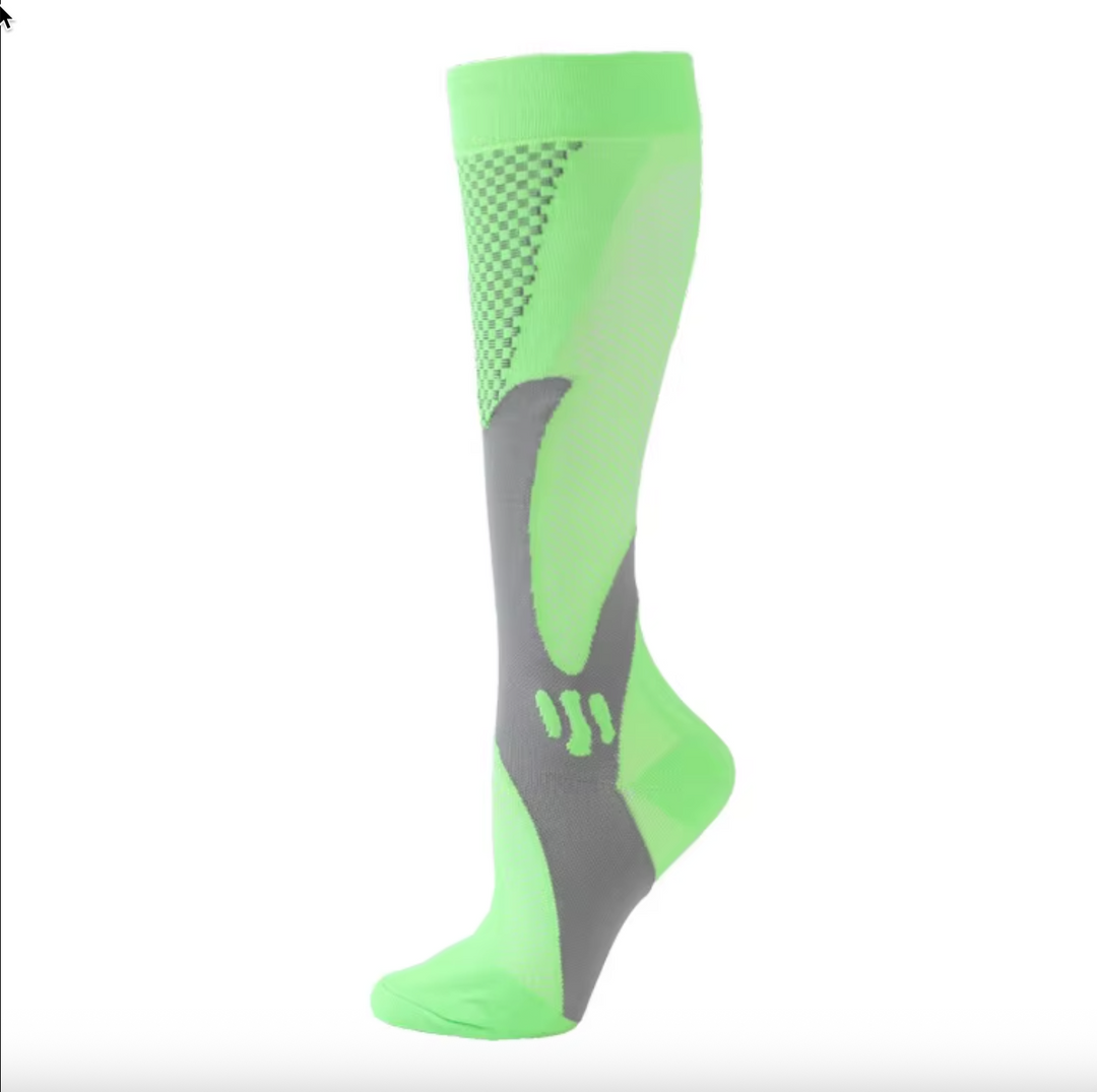 Pair of unisex compression socks paired with running shoes for athletic use.