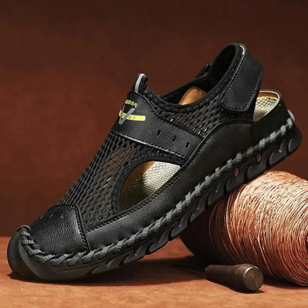 Black men's orthopedic sports sandal featuring durable treaded sole
