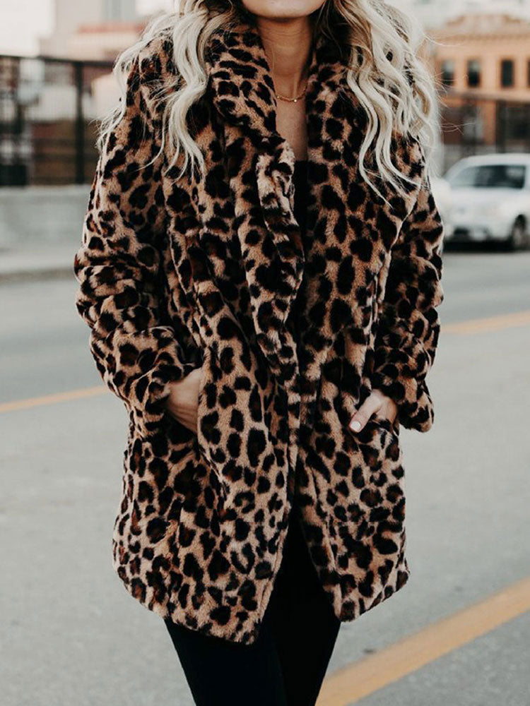 Woman wearing a stylish leopard print winter coat outdoors