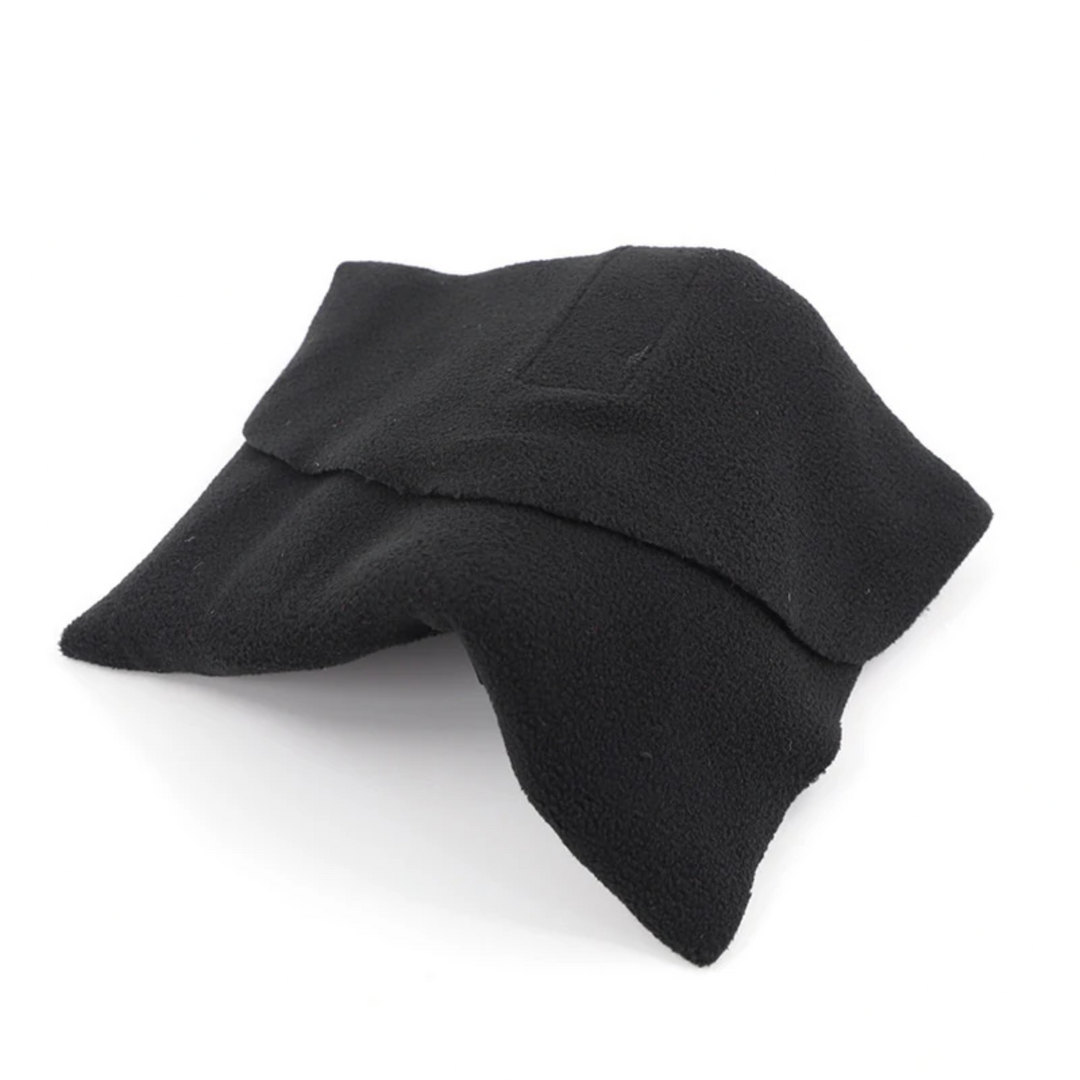 Folded black travel neck pillow on a white background