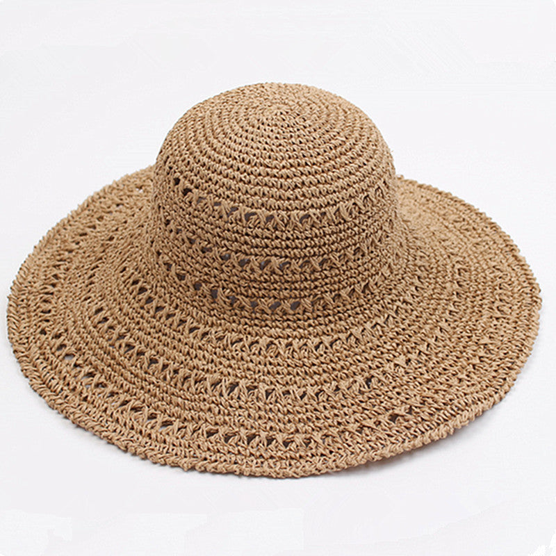 Back view of the foldable travel hat for women showing its flat brim design