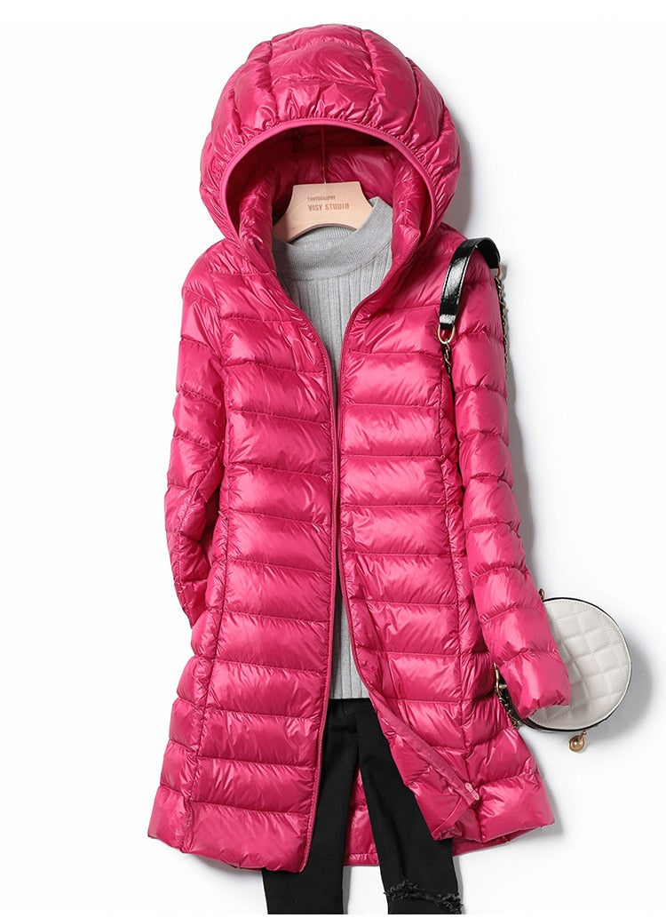 Back view of the hooded winter coat Nova for women, showcasing its sleek and modern silhouette.
