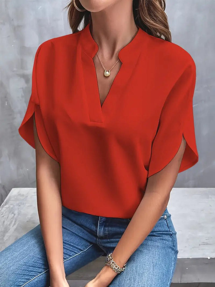 Model styling women's blouse with casual trousers for daily wear