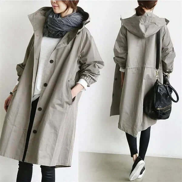 Back view of womens lightweight travel rain cape and waterproof jacket