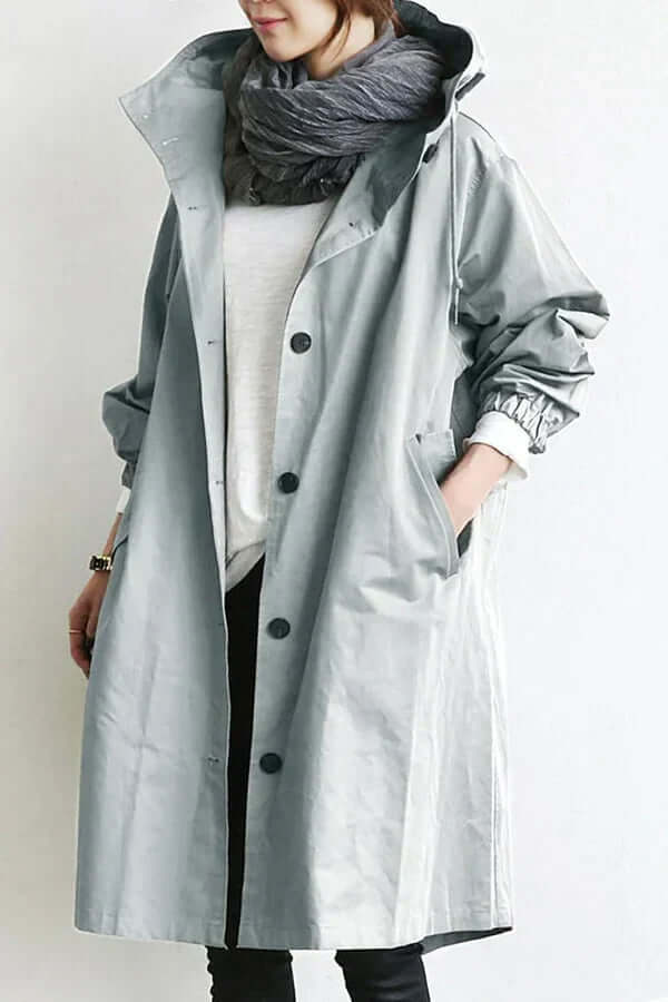 Model wearing stylish womens all weather jacket and hooded rainwear