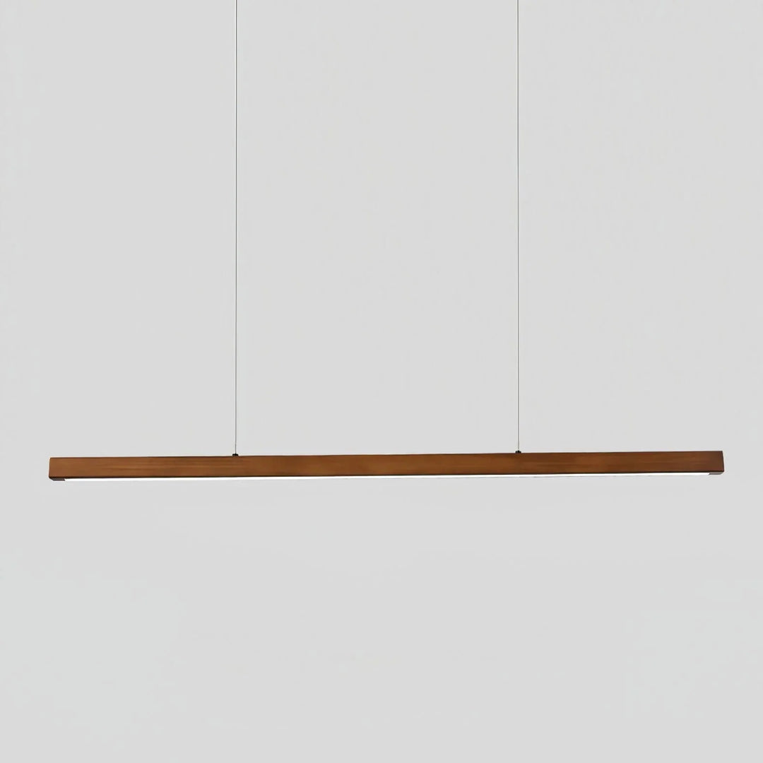 Walnut wood linear LED pendant light hanging against a plain white background