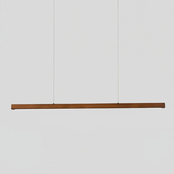 Walnut wood linear LED pendant light hanging against a plain white background