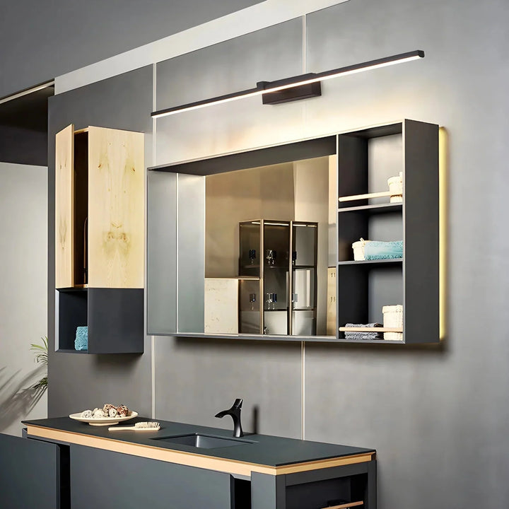 Black linear wall light installed above a modern bathroom vanity mirror