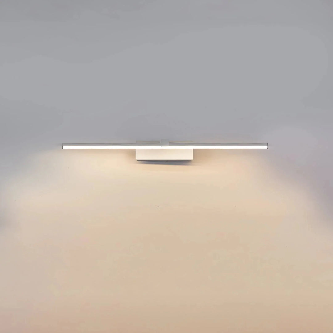 White linear LED wall light mounted horizontally with warm illumination