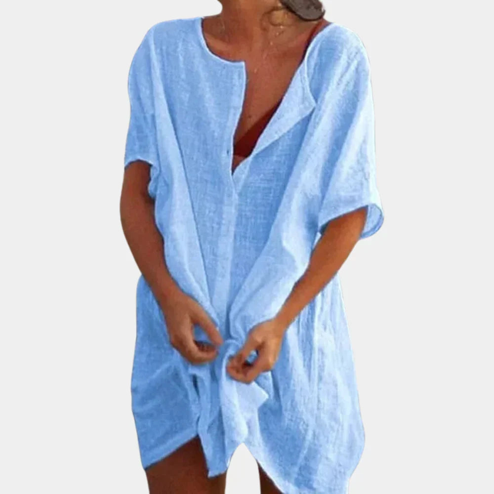 Woman wearing a light blue casual beach tunic