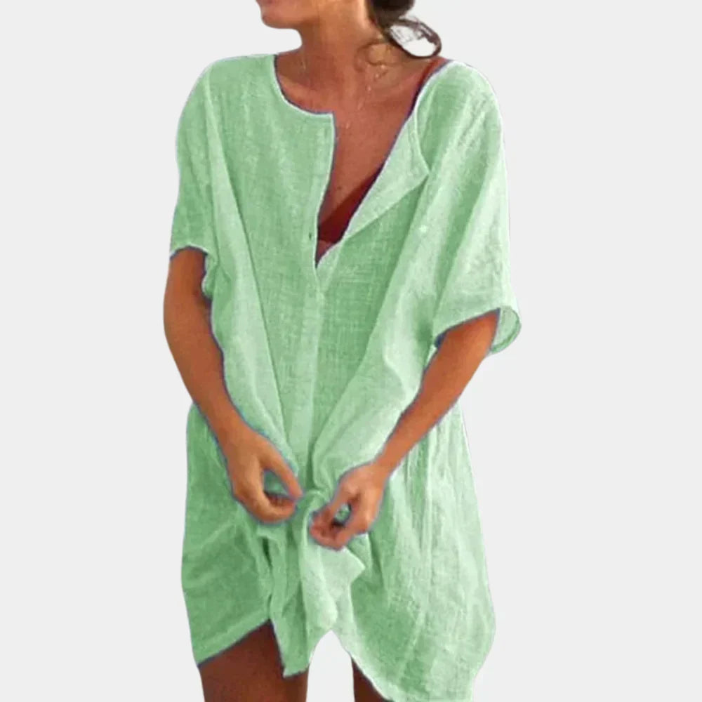 Woman wearing a pastel green casual beach tunic