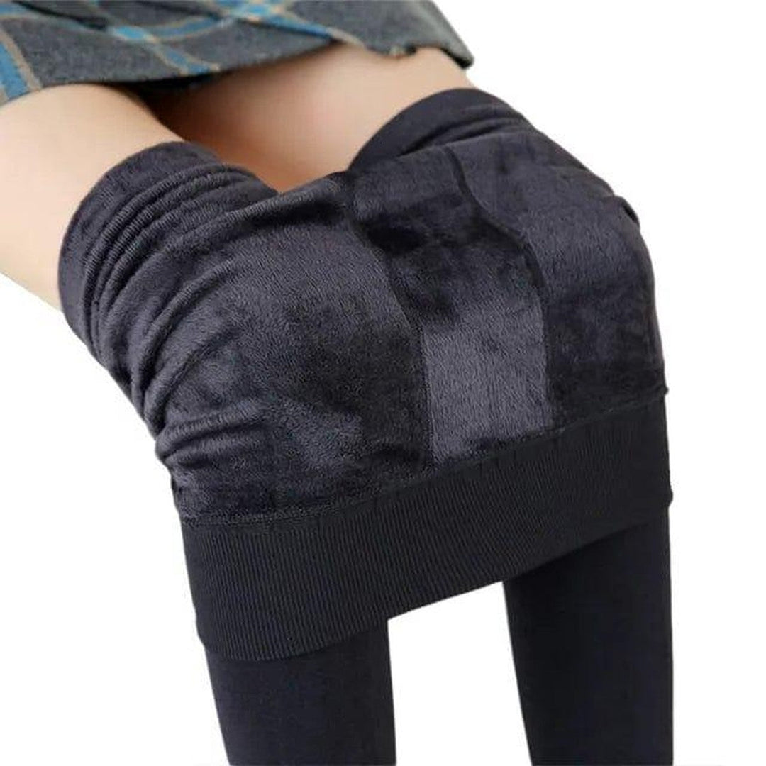 Model wearing stretch winter apparel pants for outdoor cold weather activities