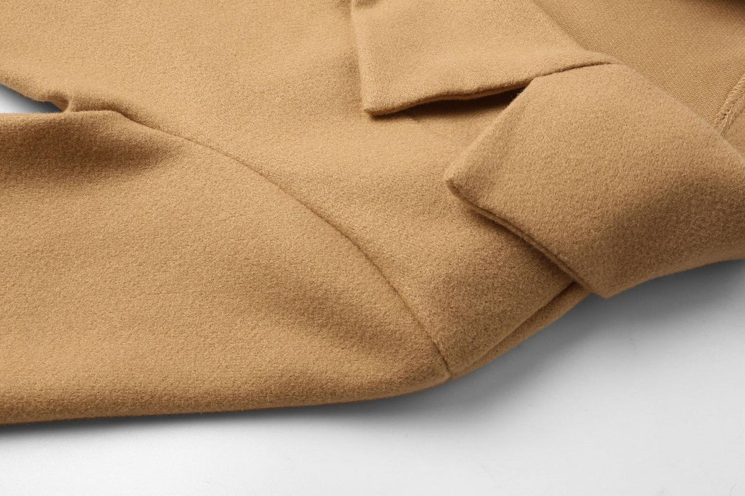 Close-up of lapel and double-breasted button closure on women's winter coat