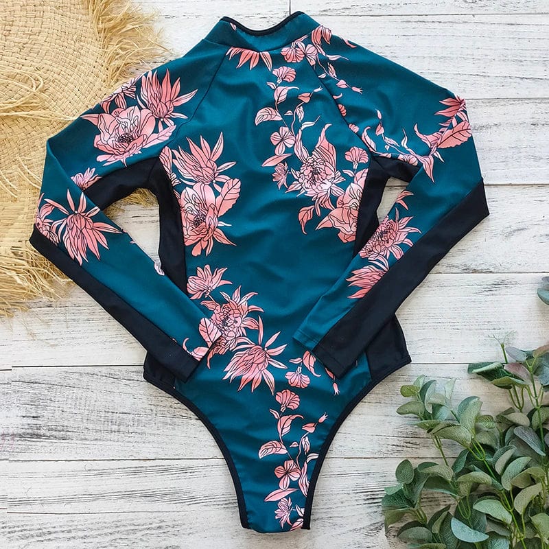 Back view of the dark green floral long-sleeve one-piece swimsuit laid flat.
