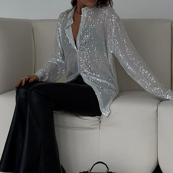 Full view of woman seated in a glittering white sequin party shirt
