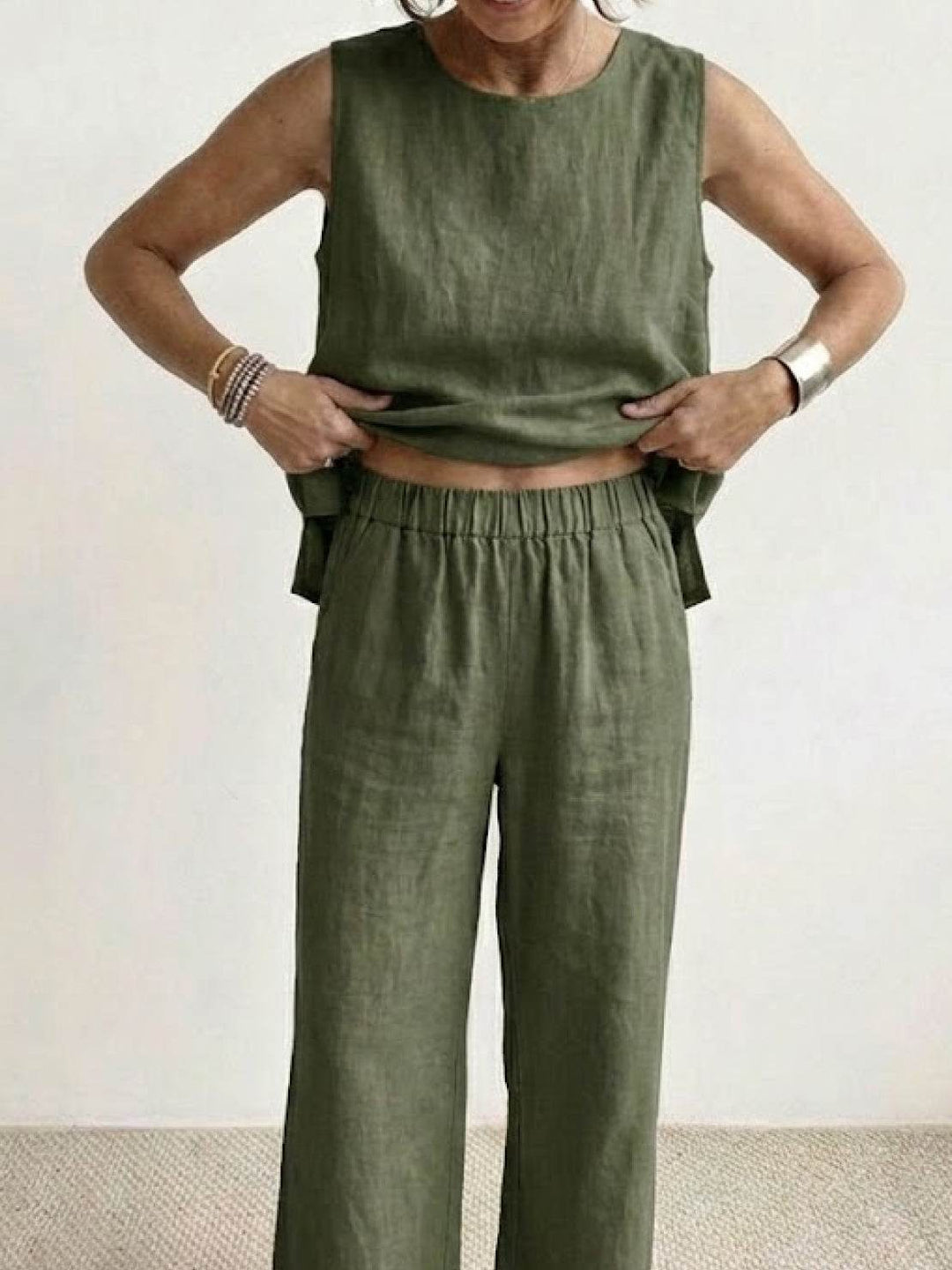 Casual summer outfit featuring a relaxed fit sleeveless top and wide-leg trousers