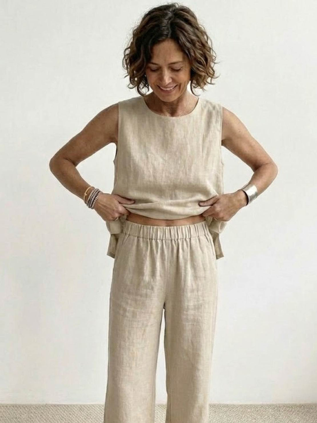 Elegant summer matching set with a draped sleeveless blouse and trousers