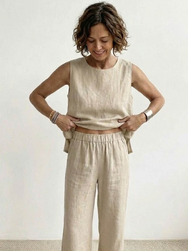 Elegant summer matching set with a draped sleeveless blouse and trousers