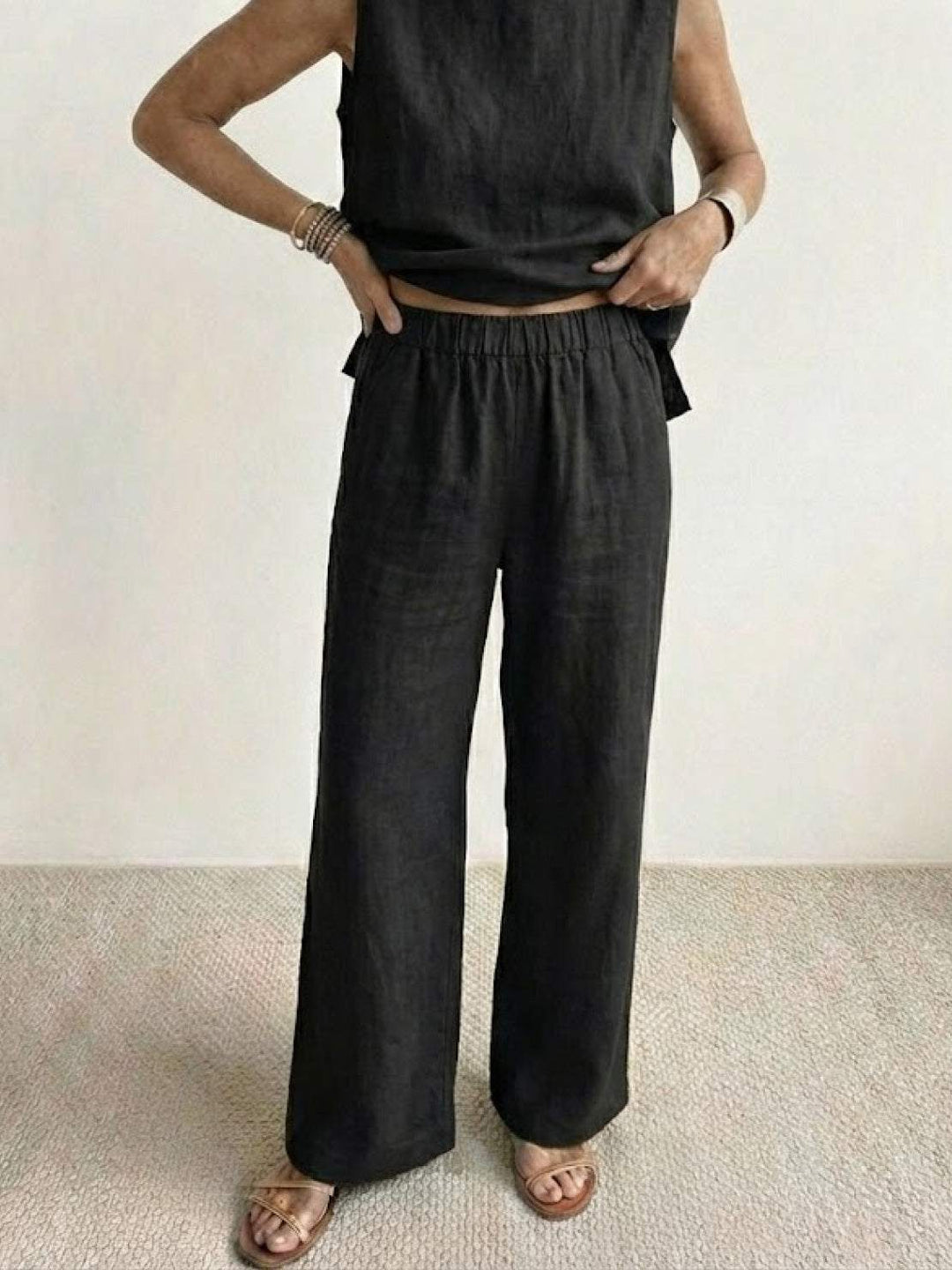 Aesthetically pleasing women's sleeveless blouse and wide leg pants outfit