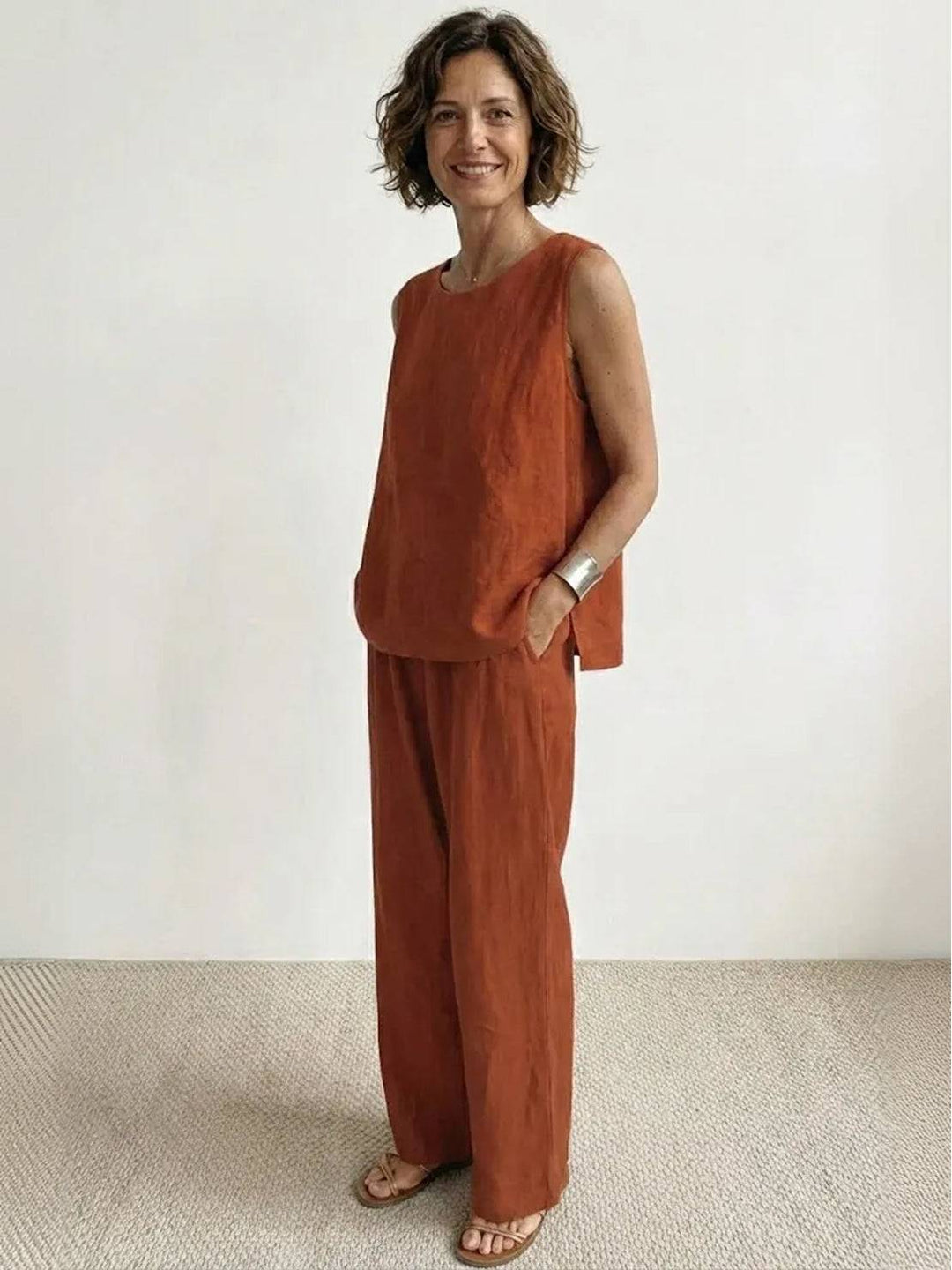 Sleek women's summer outfit with a fitted sleeveless top and wide-leg pants
