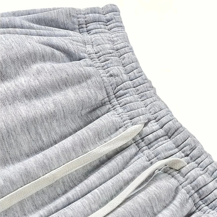 Detailed shot of waistband and pockets on mens loose loungewear pants
