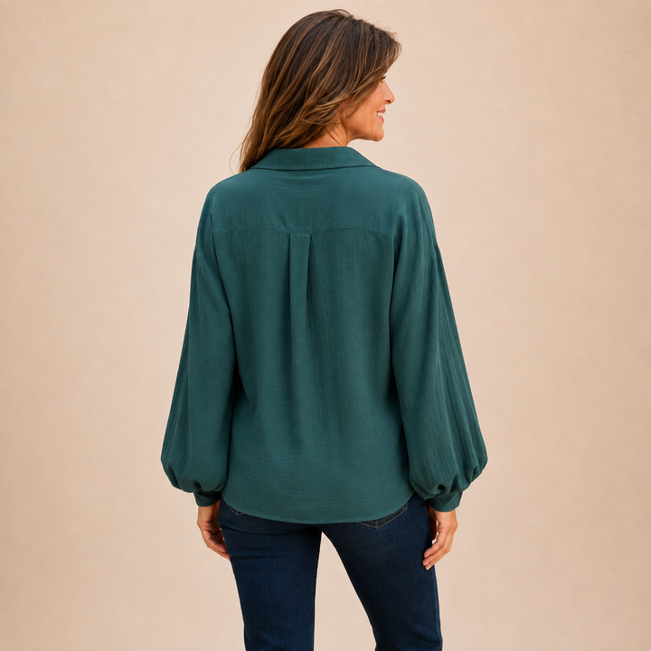 Women's relaxed fit button down shirt featuring a classic collar and long sleeves